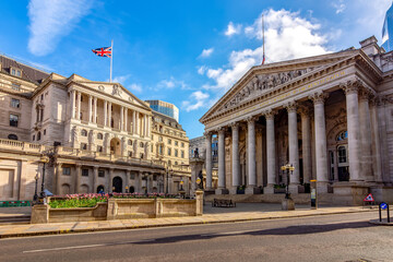 Royal Exchange and Bank of England buildings in City of London, UK (translation "founded in thirteenth year of Queen Elizabeth, and restored in eighth of Queen Victoria")