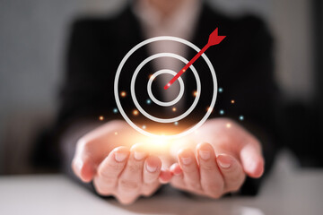 Hand holding business target goal growth success development management strategy concept