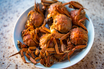 A close-up of a plate of river crabs, a traditional Chinese delicacy