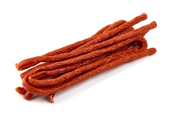 Kabanos thin dry sausage, snacks for beer, isolated on the white background.