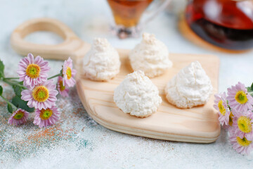 Delicious homemade meringue cookies with coconut flakes.