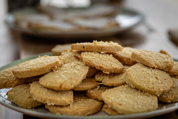 A plate of freshly baked cheese biscuits, with a shallow depth of field