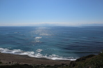 Scenic beach and rock formations in Cyprus. Mediterranean Sea, road, travel, view of mountains and sea.