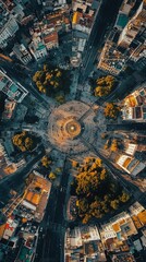 Obraz premium Aerial View of Urban Streets with Circular Park and Surrounding Cityscape