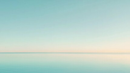 Obraz premium Tranquil Horizon Over Calm Sea at Dawn with Soft Pastel Tones