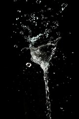 High-Speed Water Splash Isolated on Black Background - Abstract Liquid Burst with Dynamic Drops