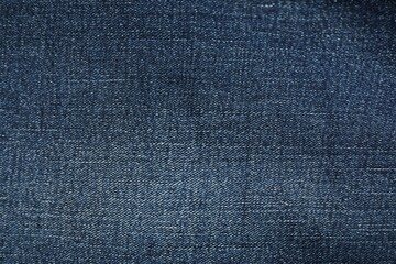 Texture of dark blue jeans as background, top view