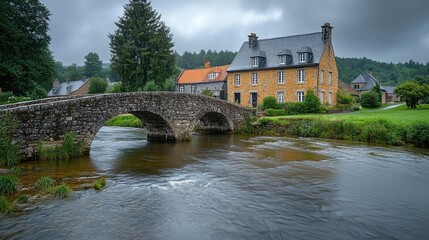 Fototapeta premium Stone Bridge Arching Over River Near Charming Village House