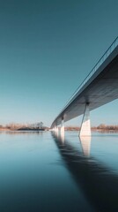 Modern Bridge Reflection Over Calm Water in Sunny Daylight