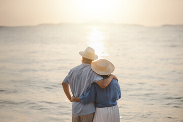 Seniors go on vacation at the beach. Seniors plan for retirement with insurance. Seniors are retired.