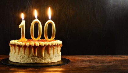 100th Anniversary candle lit on a cake with copy space