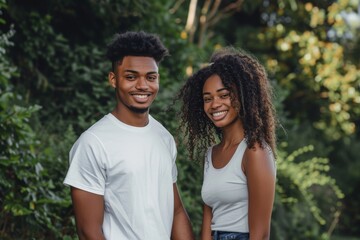 Fototapeta premium Portrait of a glad afro-american couple in their 20s holding hands