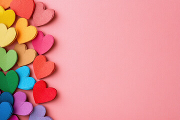 Rainbow Paper Hearts on Pink Background