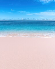 Obraz premium A serene beach scene with clear blue water and soft pink sand under a bright sky.