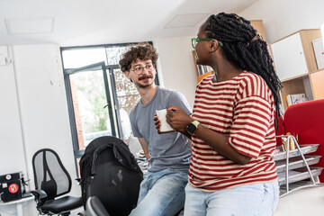In student support office, a two  student joying in a coffee break, a beacon of empowerment and...
