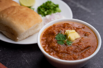Pav bhaji is a fast food dish from India consisting of a thick vegetable curry served with a soft bread roll