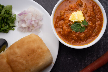 Pav bhaji is a fast food dish from India consisting of a thick vegetable curry served with a soft bread roll