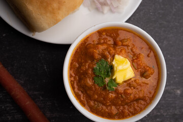 Pav bhaji is a fast food dish from India consisting of a thick vegetable curry served with a soft bread roll