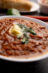Pav bhaji is a fast food dish from India consisting of a thick vegetable curry served with a soft bread roll