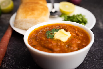 Pav bhaji is a fast food dish from India consisting of a thick vegetable curry served with a soft bread roll
