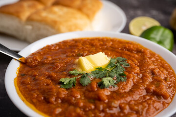 Pav bhaji is a fast food dish from India consisting of a thick vegetable curry served with a soft bread roll