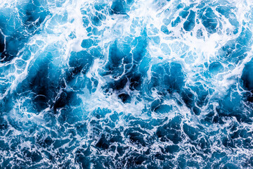 Water surface texture. Aerial view of breathtaking water with foam. Can be used in covers, packaging, posters, textures, wallpapers, art and design projects. Beautiful nature background image.
