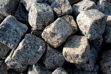 Artfully stacked natural stones at a construction site