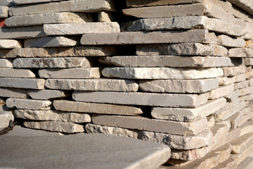 Artfully stacked natural stone blocks at construction site