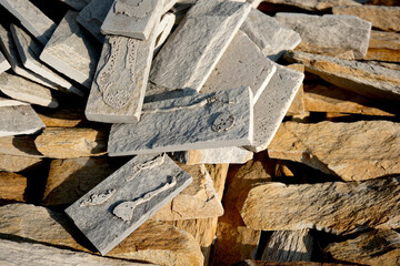 Stone remnants showcasing intricate carvings and natural textures