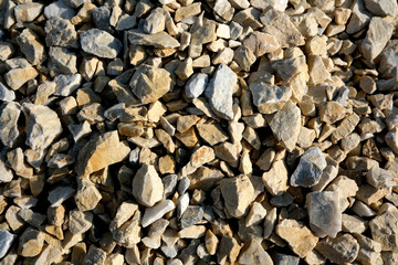 Colorful assortment of gravel stones in natural sunlight