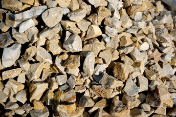 Natural gravel collection showcasing textures and colors in sunlight
