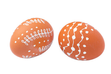 Natural brown Easter eggs with white minimalist patterns isolated on a transparent background