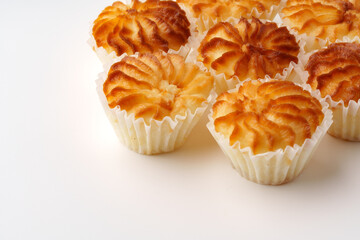 Delicious freshly baked pastries arranged neatly on a white surface in a warm kitchen setting