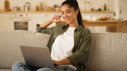 User freelance worker at home couch student receive good exams result online woman Indian girl...