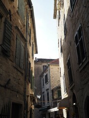 Narrow cozy sunny beige streets of Kotor, Montenegro, Balkans. Historical center of the old town