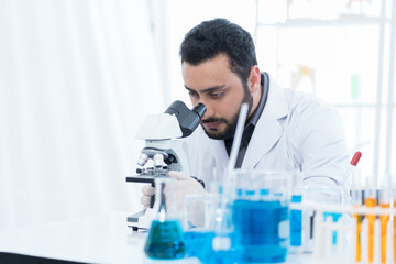 Research, microscope, and scientist doing analysis and sample test in laboratory. Specialist working with biotechnology research