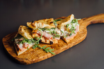 Pizza-Sandwich with Mortadella and Roasted Eggplant – A gourmet Italian creation featuring mortadella sausage, roasted eggplant, parmesan cheese, mozzarella, truffle paste, and arugula