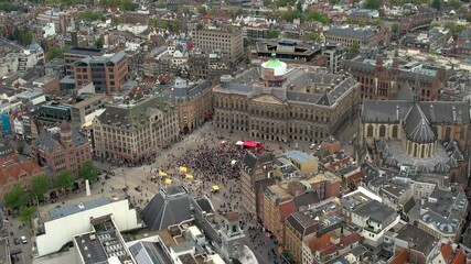 Stunning aerial footage of Koninklijk Paleis - the royal palace in Amsterdam showcasing its iconic architecture, and vibrant cityscape. 