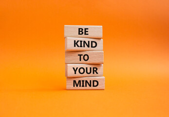 Be kind to your Mind symbol. Wooden blocks with words Be kind to your Mind. Beautiful orange background. Business and Be kind to your Mind concept. Copy space.