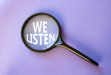 We listen symbol. Concept words We listen on magnifying glass. Beautiful purple background....