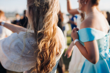 High school graduates dancing on prom, waltz and classical ball slow dance in dresses and suits on...