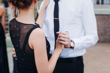 High school graduates dancing on prom, waltz and classical ball slow dance in dresses and suits on school graduation party, boys and girls ballroom dancers, couples dance quadrille and polonaise