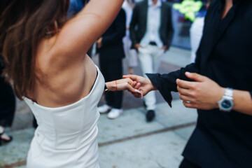 High school graduates dancing on prom, waltz and classical ball slow dance in dresses and suits on...