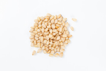 Pile Of Shelled Pine Nuts On A White Background