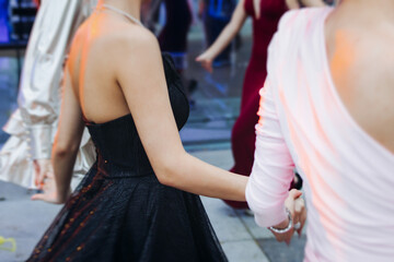 High school graduates dancing on prom, waltz and classical ball slow dance in dresses and suits on school graduation party, boys and girls ballroom dancers, couples dance quadrille and polonaise © tsuguliev