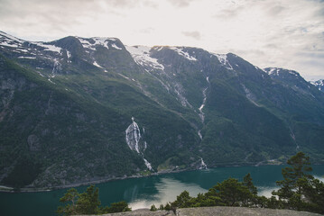 A scenic mountain valley with snowcapped peaks and tranquil waters, offering breathtaking views