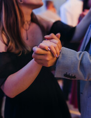 High school graduates dancing on prom, waltz and classical ball slow dance in dresses and suits on...