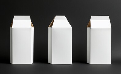 Three blank white cardboard boxes on black background. (1)