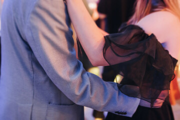 High school graduates dancing on prom, waltz and classical ball slow dance in dresses and suits on...