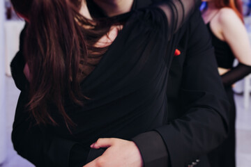 High school graduates dancing on prom, waltz and classical ball slow dance in dresses and suits on...